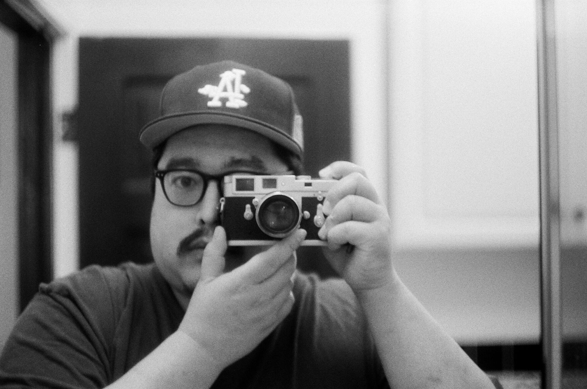 Greg Yee taking a photograph 