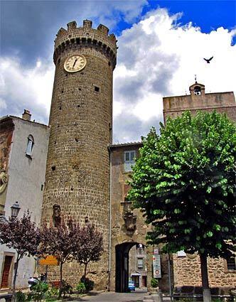 A clock tower juts out from the medieval town of Bagnaia, home to the Villa Lante gardens.