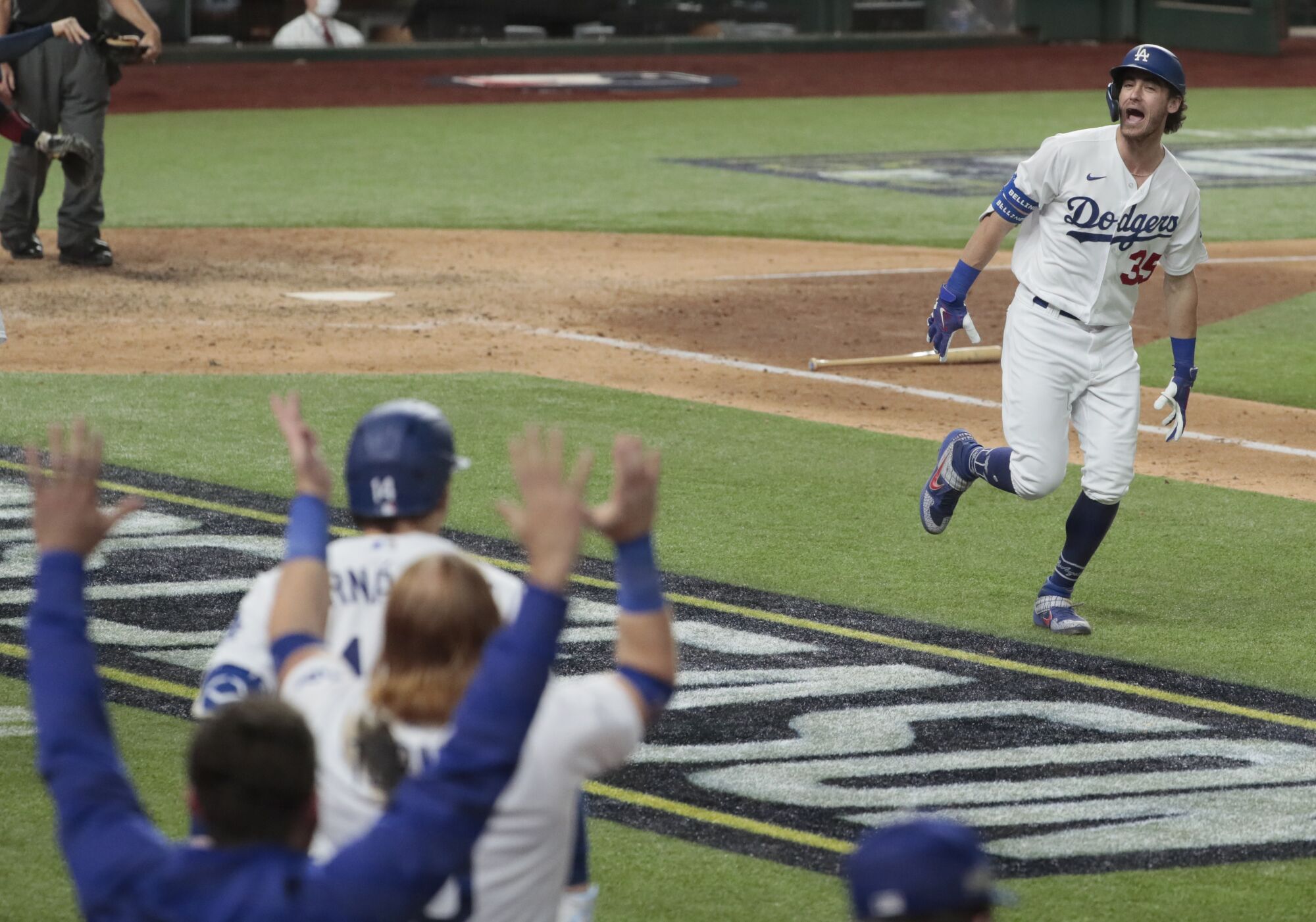 Cody Bellinger yells to the dugout on his way to first base after his seventh-inning homer.