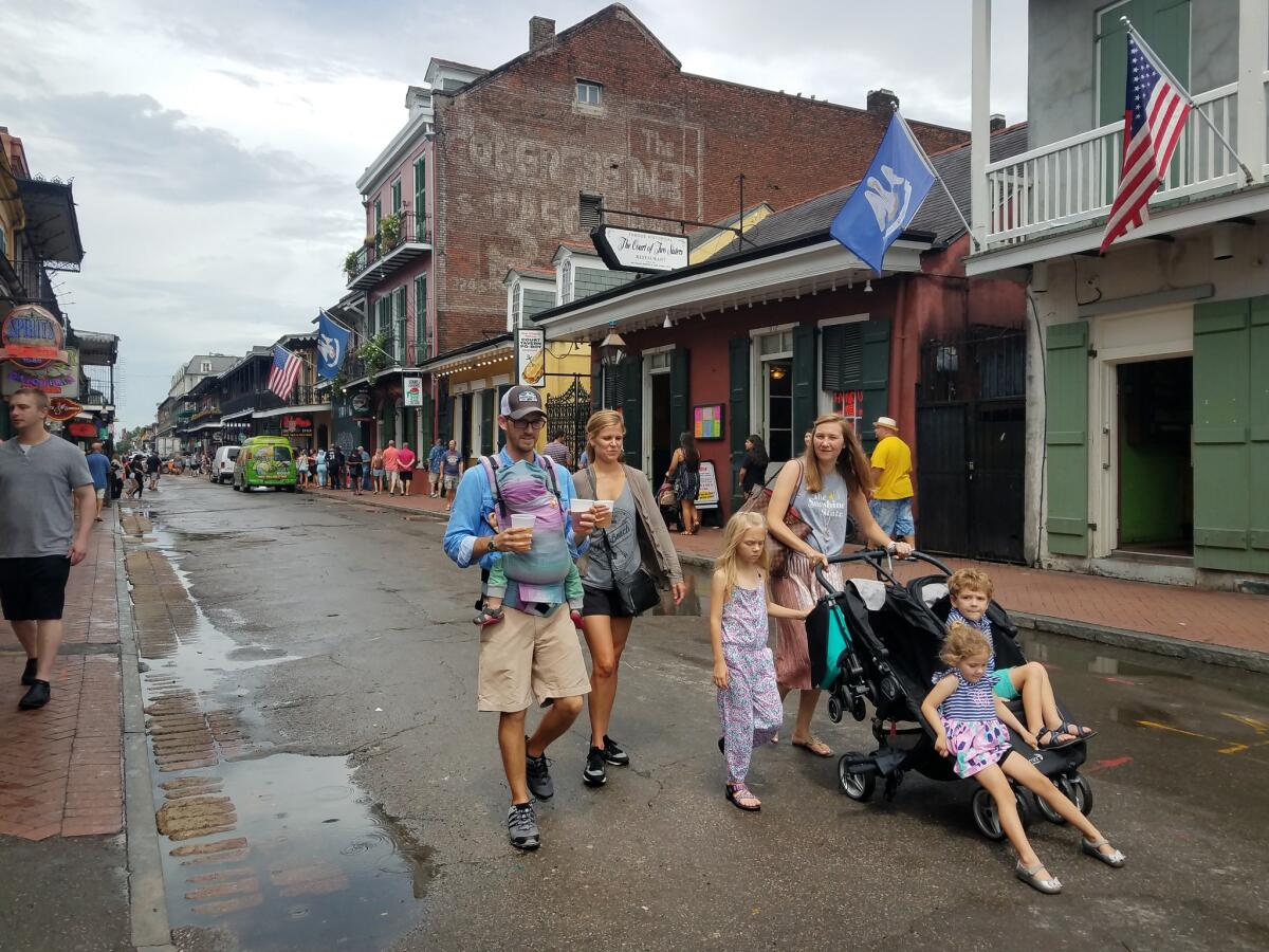 Jon Centella, 36, a sales director from Memphis, Tenn., walks down Bourbon Street on a recent weekend with his family.