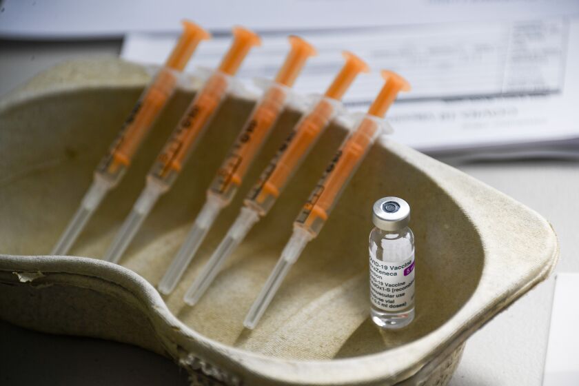 FILE - In this Sunday, March 21, 2021 file photo a vial and syringes of the AstraZeneca COVID-19 vaccine, at the Guru Nanak Gurdwara Sikh temple, on the day the first Vaisakhi Vaccine Clinic is launched, in Luton, England. Results from a U.S. trial of AstraZeneca's COVID-19 vaccine may have used "outdated information," U.S. federal health officials said early Tuesday March 23, 2021. (AP Photo/Alberto Pezzali, File)