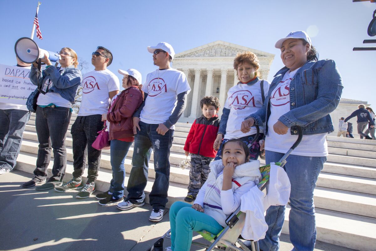 Activists demonstrate at the Supreme Court earlier this year in support of President Obama's executive action to grant deportation relief to keep immigrant families together.