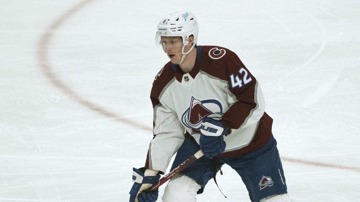 Colorado Avalanche's Josh Manson looks to pass the puck.