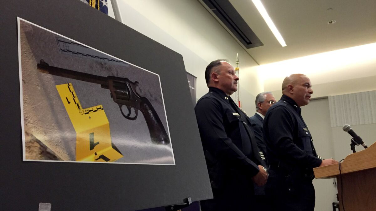 Los Angeles police say Jesse Romero carried this gun before he was fatally shot by police in August. The LAPD has said the 14-year-old fired the revolver at officers; a woman who said she saw the shooting said the teen threw the gun away and it fired as it hit the ground.