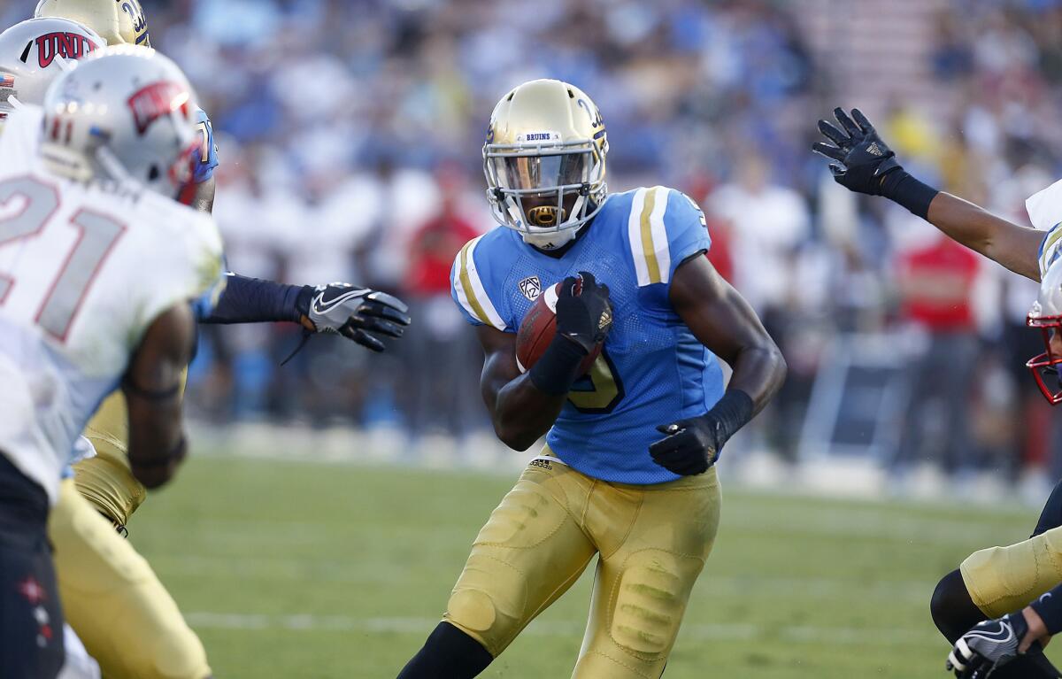 UCLA running back Soso Jamabo scores a touchdown late in the second quarter against UNLV on Sept. 10.