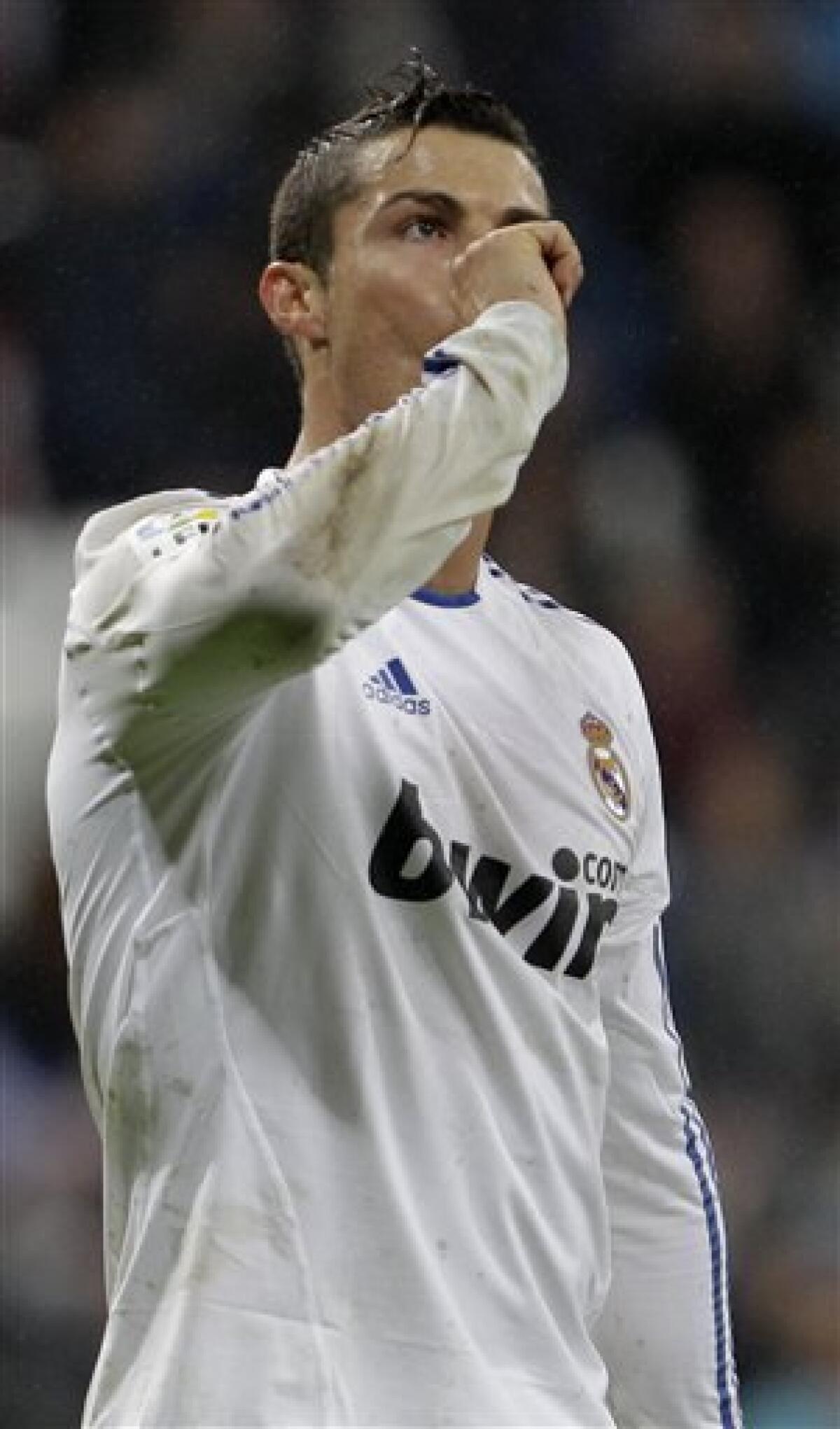 Real Madrid's Cristiano Ronaldo from Portugal reacts after scoring against Levante during a Spanish Copa del Rey soccer match at the Bernabeu stadium in Madrid, Wednesday Dec. 22, 2010.(AP Photo/Paul White)