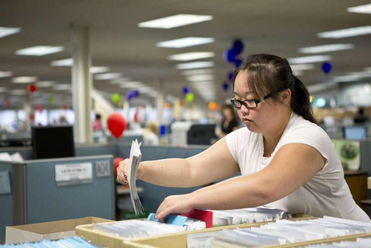 State workers handle income tax returns at the California Franchise Tax Board offices.