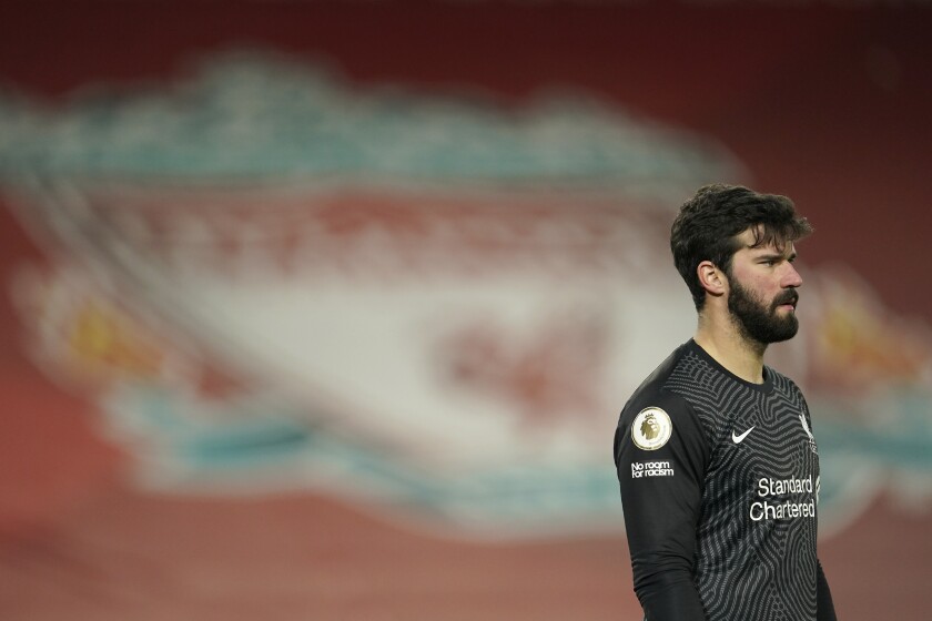 Liverpool's goalkeeper Alisson stands on the pitch during the English Premier League soccer match between Liverpool and Manchester City at Anfield Stadium, Liverpool, England, Sunday, Feb. 7, 2021. (AP photo/Jon Super, Pool)
