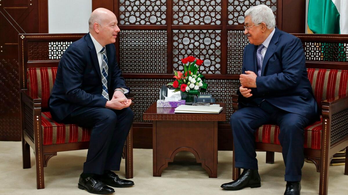 Palestinian Authority President Mahmoud Abbas, right, meets with Jason Greenblatt, President Trump's special representative for international negotiations, in the West Bank city of Ramallah on March 14, 2017.