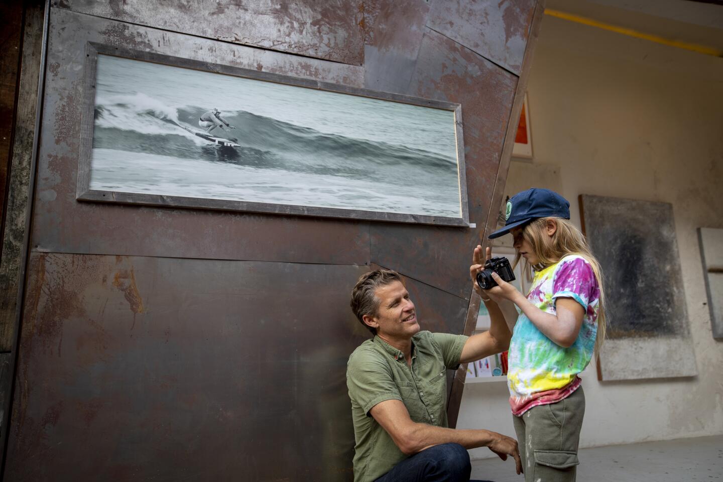 Laguna's art festivals are the big draw in summer. At the Sawdust Festival, photographer Gabe Sullivan, an exhibitor, coaches his son, Elijah, 9, on using a film camera.