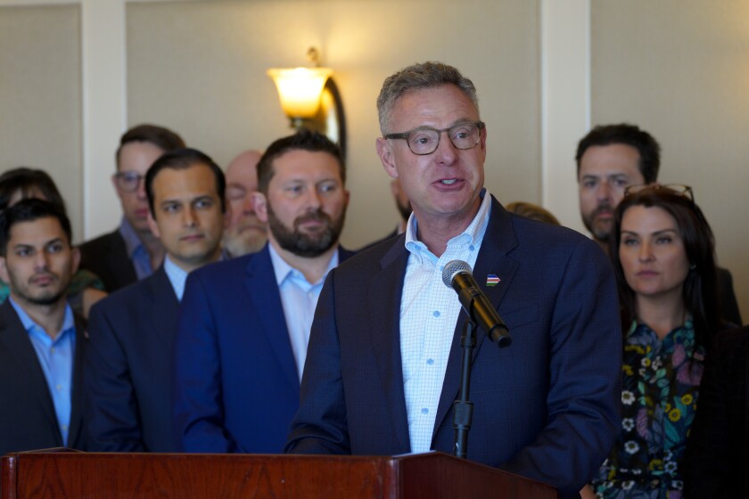 Rep. Scott Peters speaks at a press conference with supporters of the bipartisan Afghan Adjustment Act