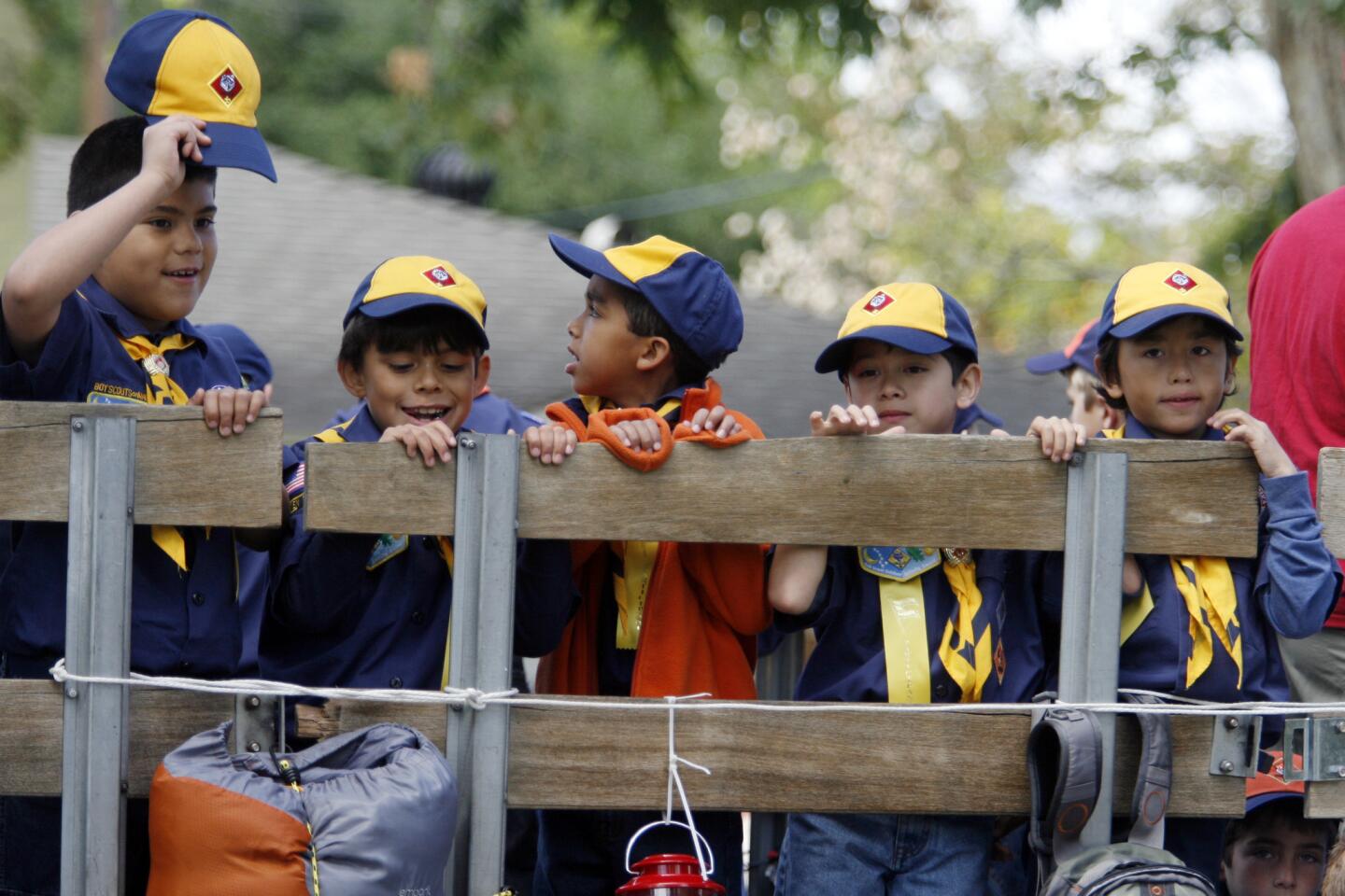 Cub Scouts Pack 225 members Joseph Anasacio, 7, from left, Elijah Zuniga, 7, Max Crosby, 8, Evan Sanchez, 7, and Frank Leszczynski, 7, wait on a truck before participating in Burbank on Parade, which took place on Olive Ave. between Keystone St. and Lomita St. on Saturday, April 14, 2012.