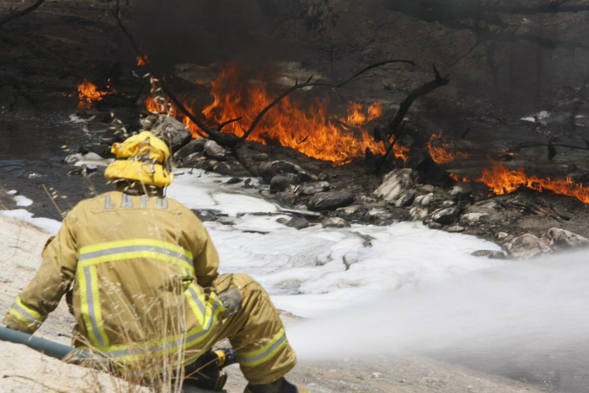 No one was hurt in a dramatic fire at the 5 and 2 freeway interchange in the Elysian Valley area on Saturday, June 13, 2013 near Glendale.