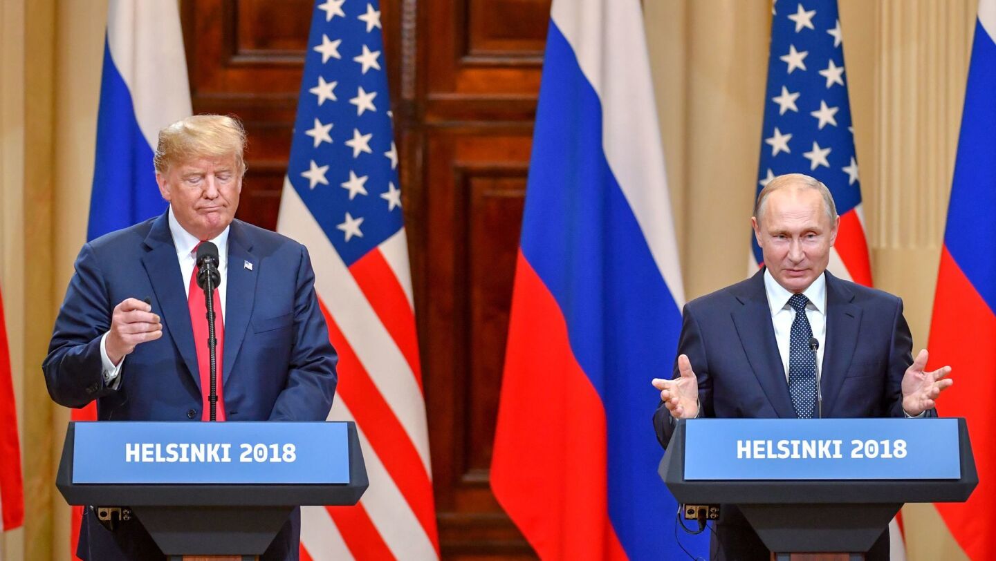 President Trump, left, and Russia's President Vladimir Putin attend a joint press conference after a meeting at the Presidential Palace in Helsinki, Finland, on July 16.