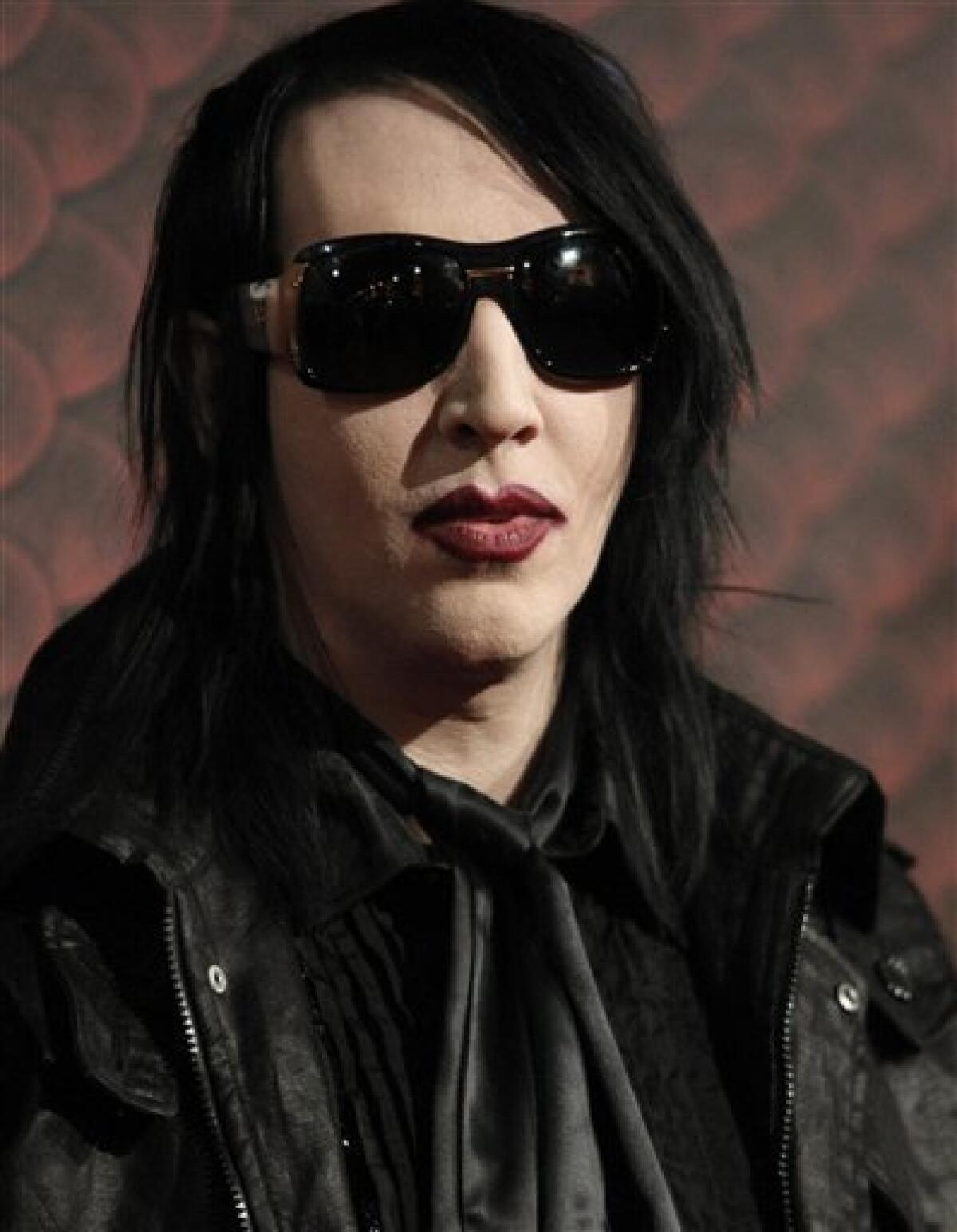 In this photo taken on Saturday, Oct. 18, 2008, singer Marilyn Manson poses on the press line at the Scream Awards in Los Angeles. (AP Photo/Dan Steinberg)