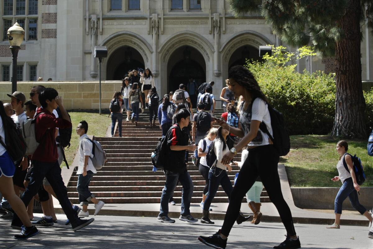 Students walk along Bruin Walk on the UCLA campus.