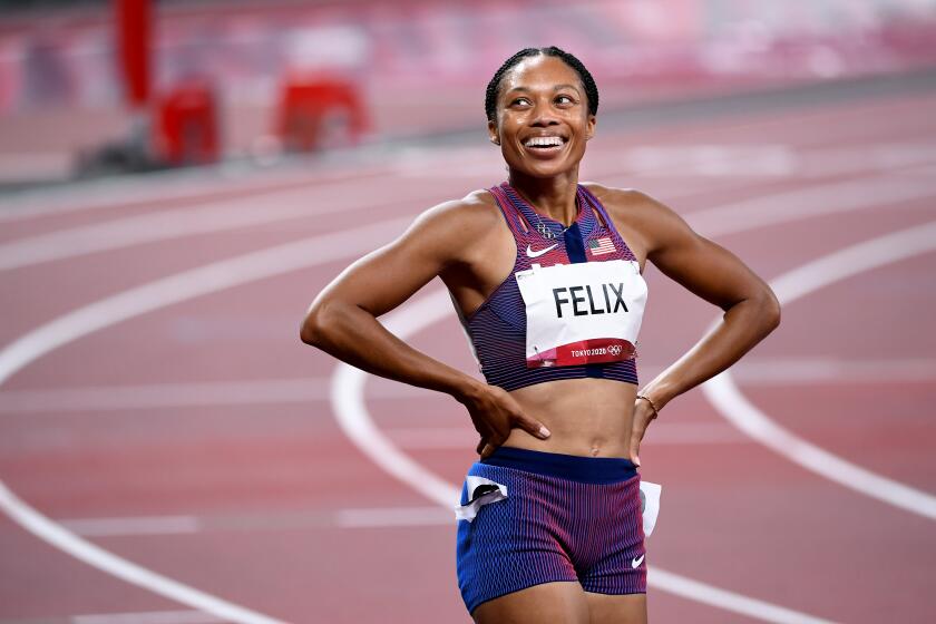 -TOKYO,JAPAN August 6, 2021: USA's Allyson Felix smiles after winning the bronze medal in the 400m race at the 2020 Tokyo Olympics. (Wally Skalij /Los Angeles Times)