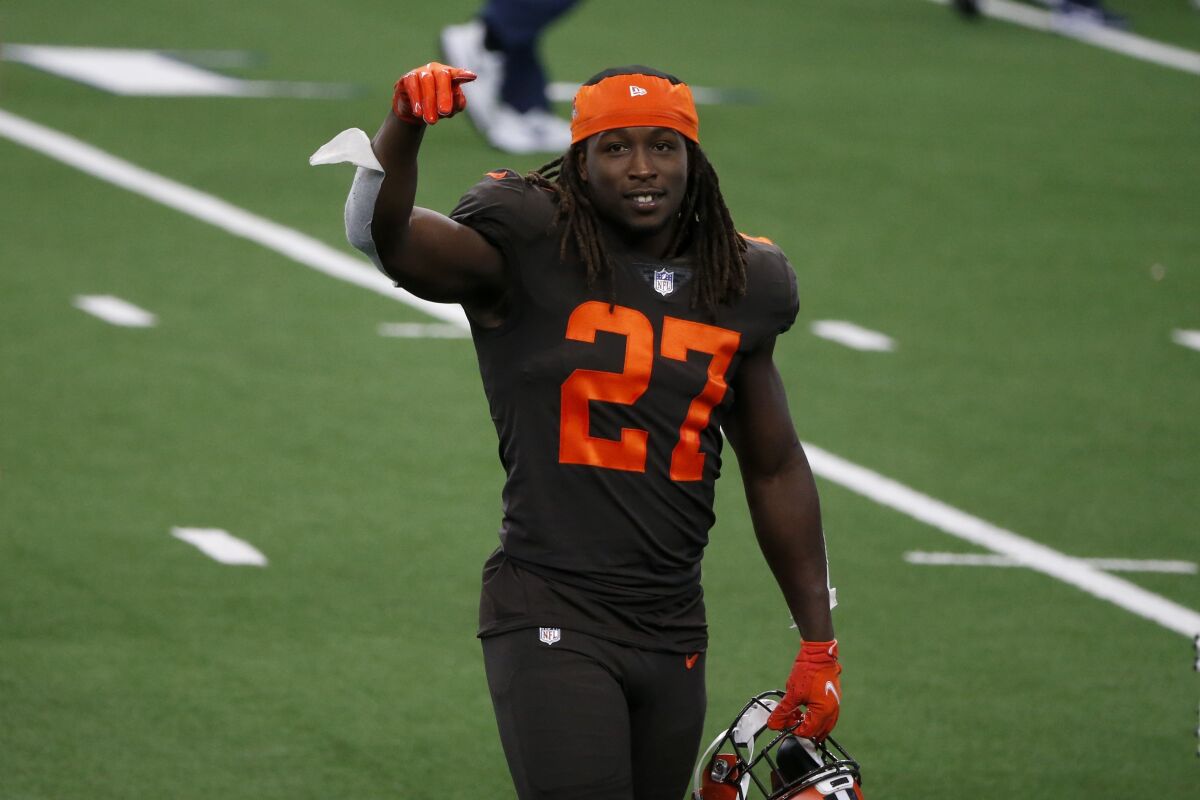 Cleveland Browns running back Kareem Hunt (27) celebrates after their 49-38 win agains the Dallas Cowboys in an NFL football game in Arlington, Texas, Sunday, Oct. 4, 2020. (AP Photo/Michael Ainsworth)