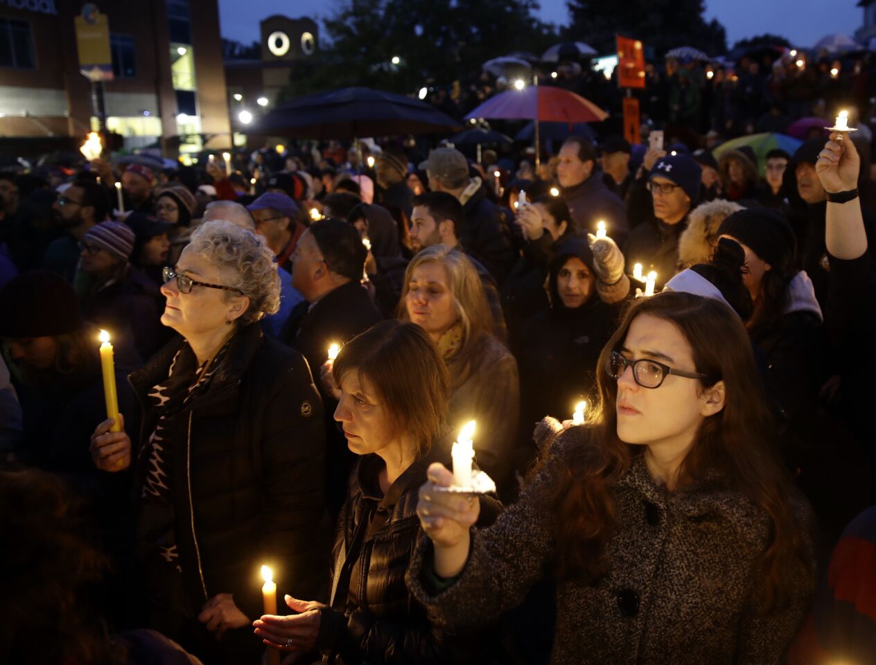 People hold candles as they gather for a vigil in the aftermath of a deadly shooting at the Tree of Life synangogue in the Squirrel Hill neighborhood of Pittsburgh on Oct. 27, 2018.