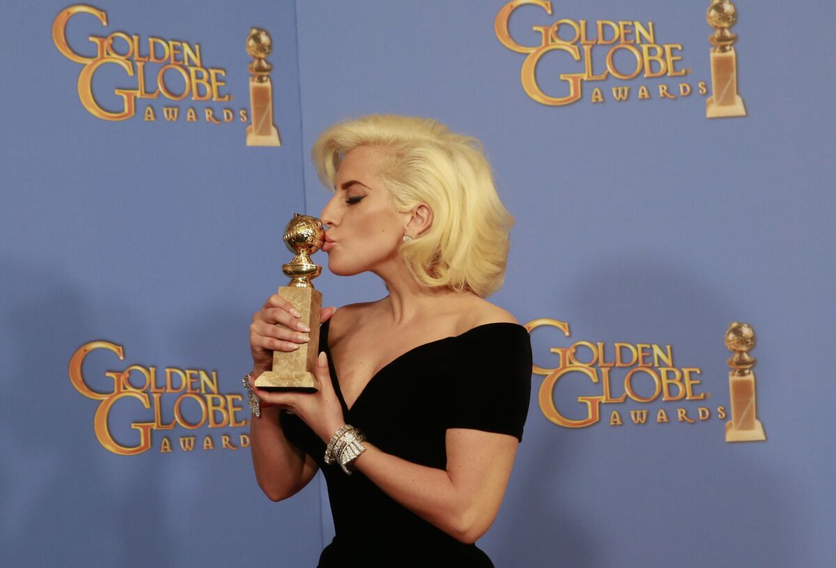 Lady Gaga with her Golden Globe for actress in a miniseries or a motion picture. She will perform the national anthem at Super Bowl 50.
