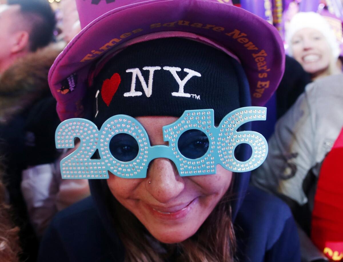 A New Year's Eve reveller at Times Square moments before midnight on Dec. 31.