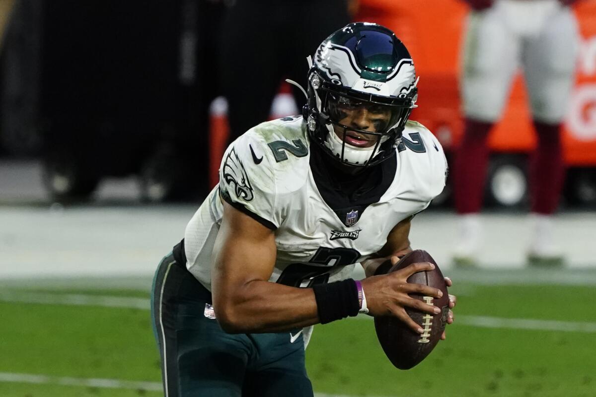 Philadelphia Eagles quarterback Jalen Hurts looks to pass against the Arizona Cardinals on Dec. 20.