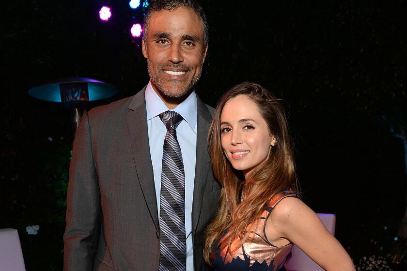 Rick Fox and Eliza Dushku, shown last August, have split after five years together.