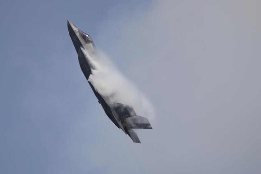 FILE - A U.S. Marine Corps F-35B Lightning II takes part in an aerial display during the Singapore Airshow 2022 at Changi Exhibition Centre in Singapore, on Feb. 15, 2022. The crash of an F-35B Joint Strike Fighter aircraft in South Carolina over the weekend has raised numerous questions about what prompted the pilot to eject after experiencing a malfunction and how the $100 million warplane was able to keep flying pilotless for 60 miles before crashing. (AP Photo/Suhaimi Abdullah, File)