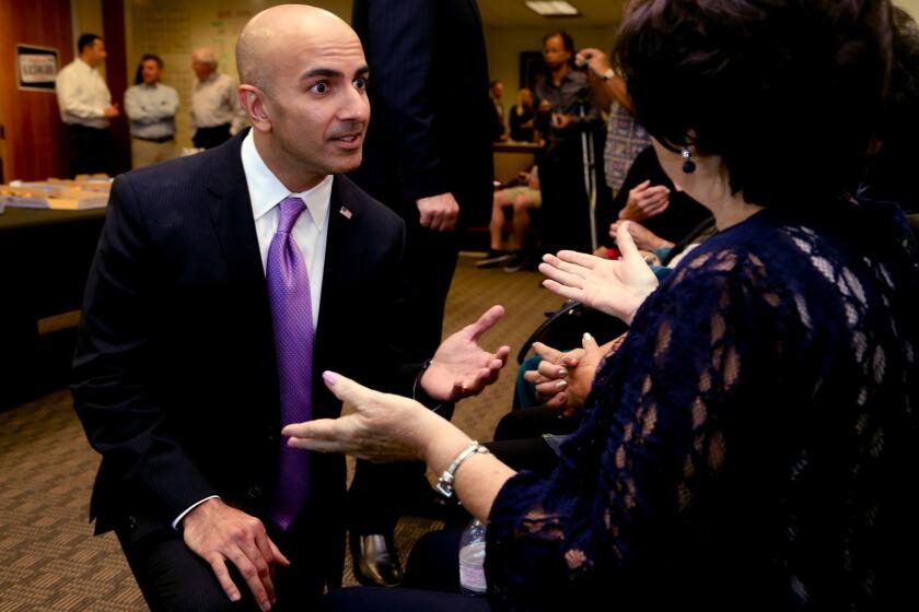 Republican gubernatorial candidate Neel Kashkari talks to supporters during a get-out-the-vote rally at the Orange County Republican Party Headquarters in Tustin on the eve of the midterm election on Nov. 3, 2014
