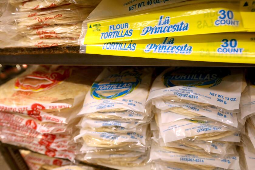 LOS ANGELES, CA - MAY 16, 2024 - Stacks of tortillas available for customers at La Princesita Tortilleria in Los Angeles on May 16, 2024. Manufacturers of corn masa flour, like La Princesita Tortilleria, may be mandated to add a new ingredient to some products sold in California if Assembly Bill 1830 passes. The bill would require folic acid to be added to popularly consumed food items that use corn masa flour, like chips, tortillas, tamales and pupusas. Folic acid is an important ingredient for women of reproductive age requiring it to be in some common foods would particularly benefit Latina women, who are less likely to take it early on in pregnancy, according to public health data released by the state. (Genaro Molina/Los Angeles Times)