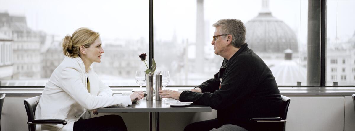 Julia Roberts and director Mike Nichols on the set of the comedy-drama "Closer."