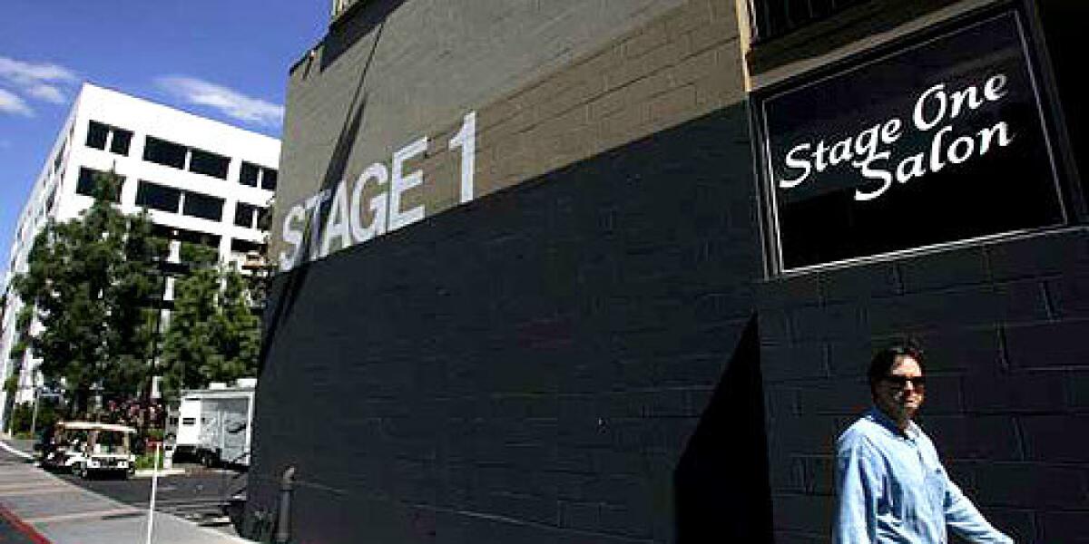 A man walks past the Stage One Salon on the Universal Studios lot in Universal City. The salon will shut down after 25 years of business to make way for studio expansion.