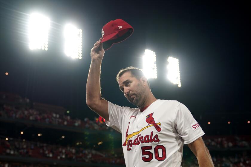 ;St. Louis Cardinals starting pitcher Adam Wainwright tips his cap after earning the win in a baseball game against the Milwaukee Brewers for his 200th career victory Monday, Sept. 18, 2023, in St. Louis. (AP Photo/Jeff Roberson)