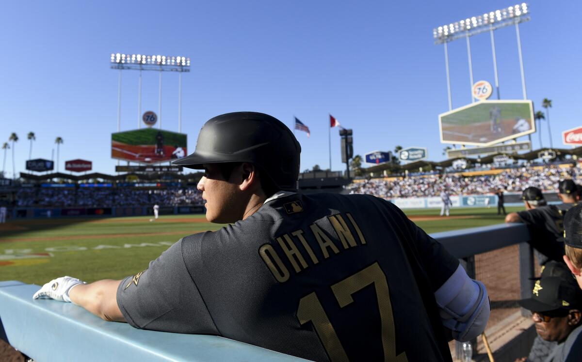 Shohei Ohtani stands in the dugout at Dodger Stadium during the 2022 MLB All-Star Game.
