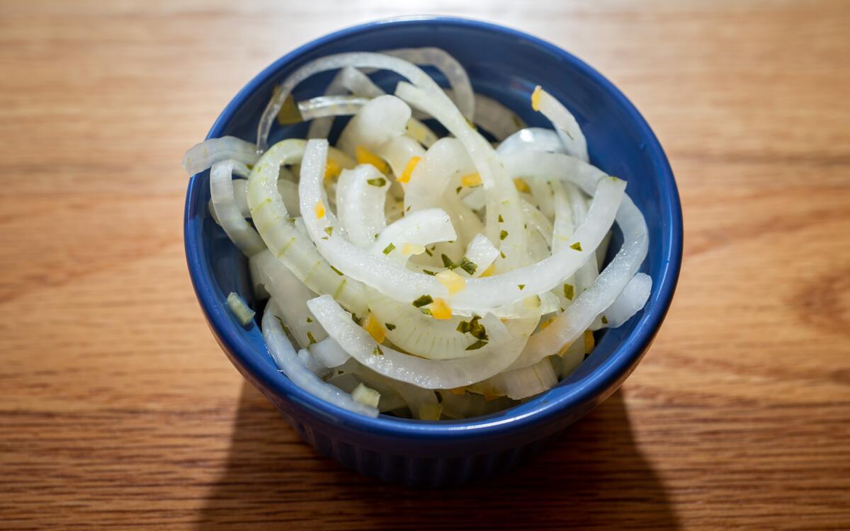 Piquant aji amarillo chiles lend their color and distinctive heat to these pickled white onions
