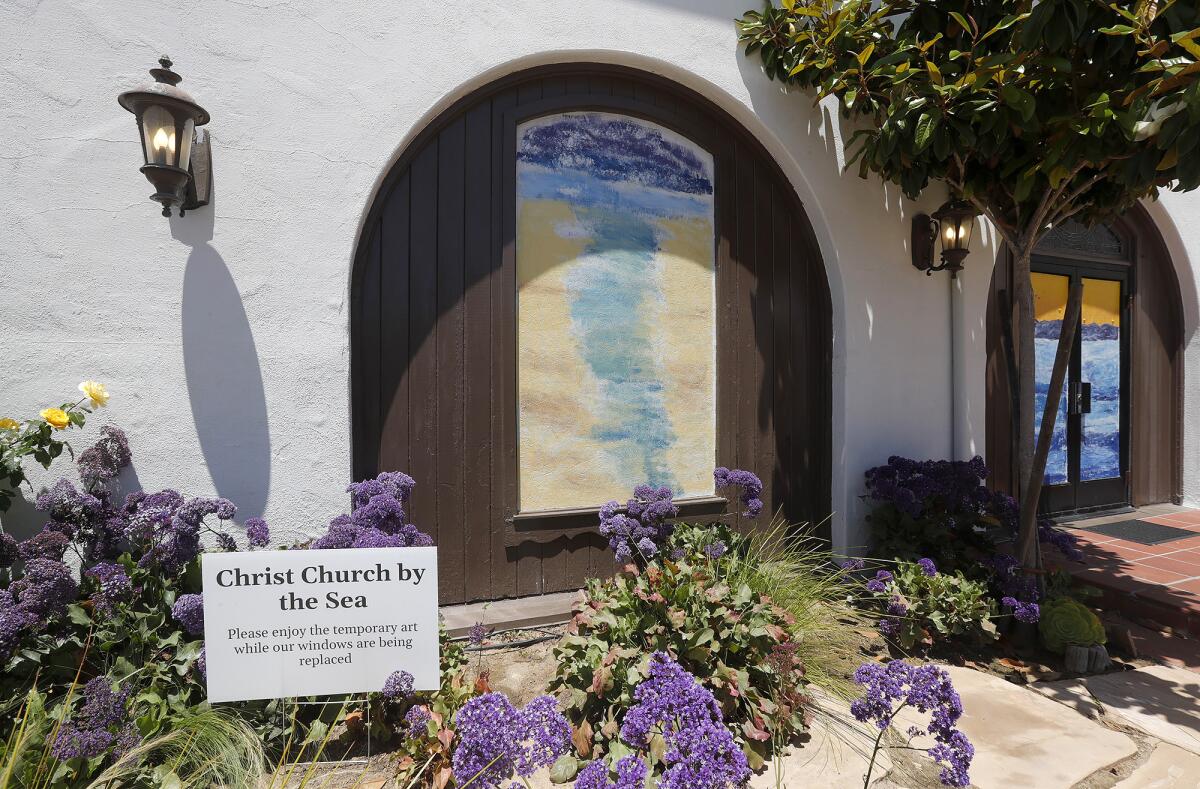 A church member created large colorful panels to temporarily spruce up the space where stained-glass windows were shattered.