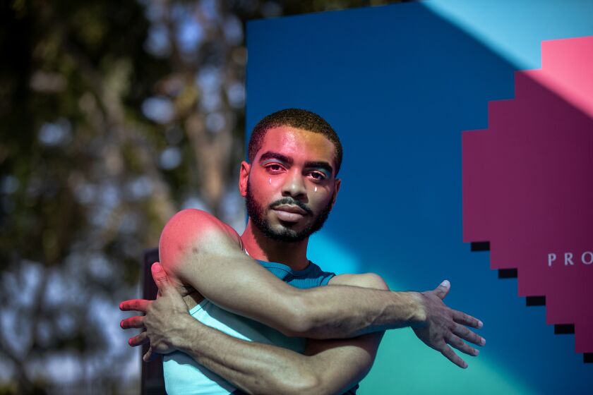 Zerrick Payne, of Los Angeles, poses while dancing at the NYX Makeup booth and celebrating at the WeHo Pride