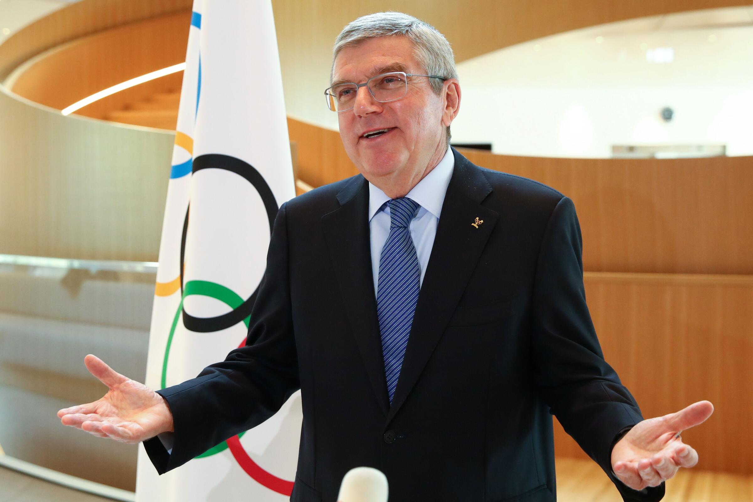 International Olympic Committee (IOC) President Thomas Bach gestures as he speaks during an interview after the historic decision to postpone the 2020 Tokyo Olympic Games due to the coronavirus pandemic, in Lausanne, Switzerland, on March 25, 2020. - Olympic chief Bach says "all options are on the table" over finding a new date to hold the postponed Tokyo Games. Tokyo 2020 became the first Olympics in peacetime to be postponed due to the coronavirus pandemic. Announcing the unprecedented decision on March 24, the International Olympic Committee gave no specific new date, saying only it would be "beyond 2020 but not later than summer 2021". (Photo by Denis Balibouse / POOL / AFP) (Photo by DENIS BALIBOUSE/POOL/AFP via Getty Images)