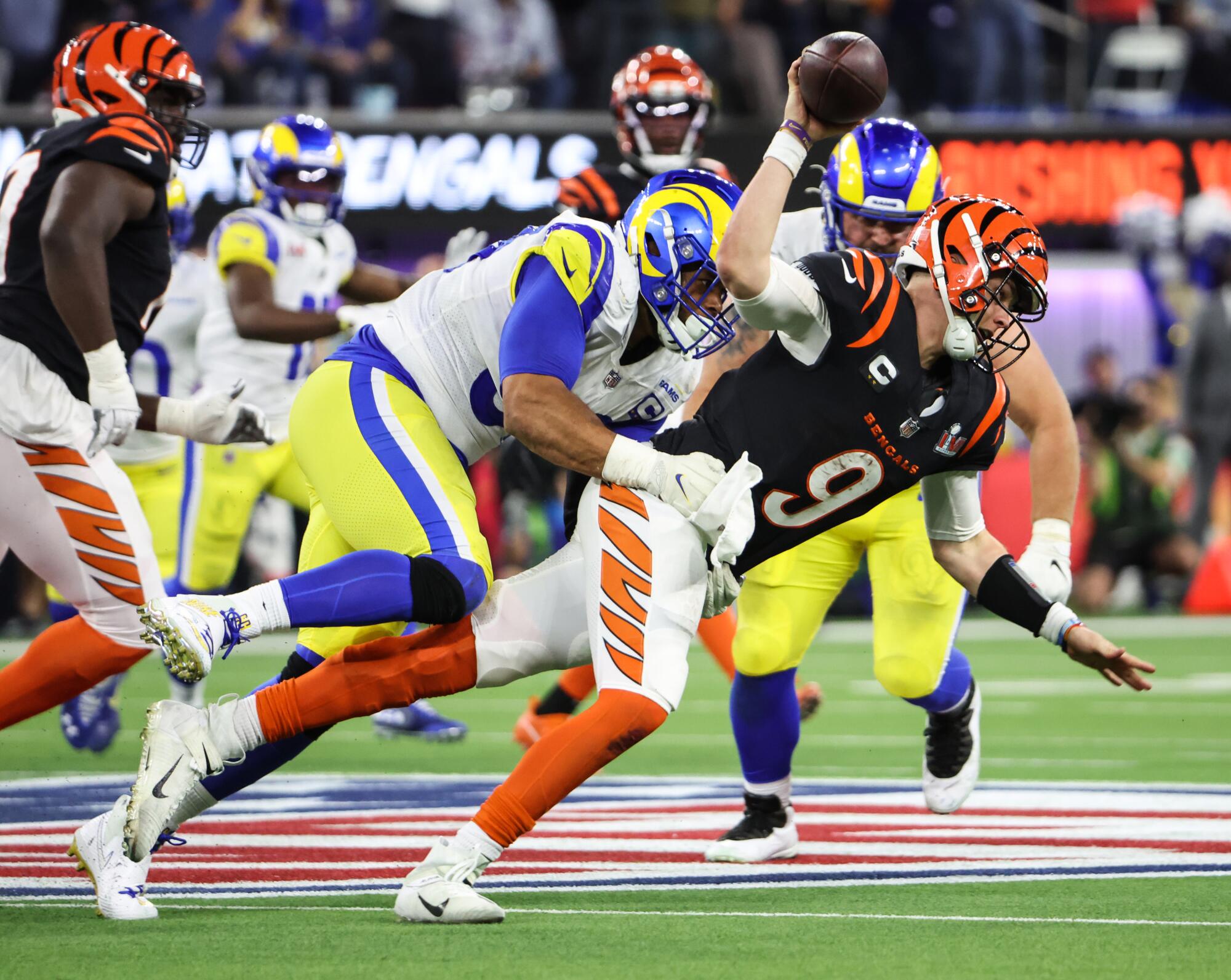  Rams defensive end Aaron Donald pressures Bengals quarterback Joe Burrow.