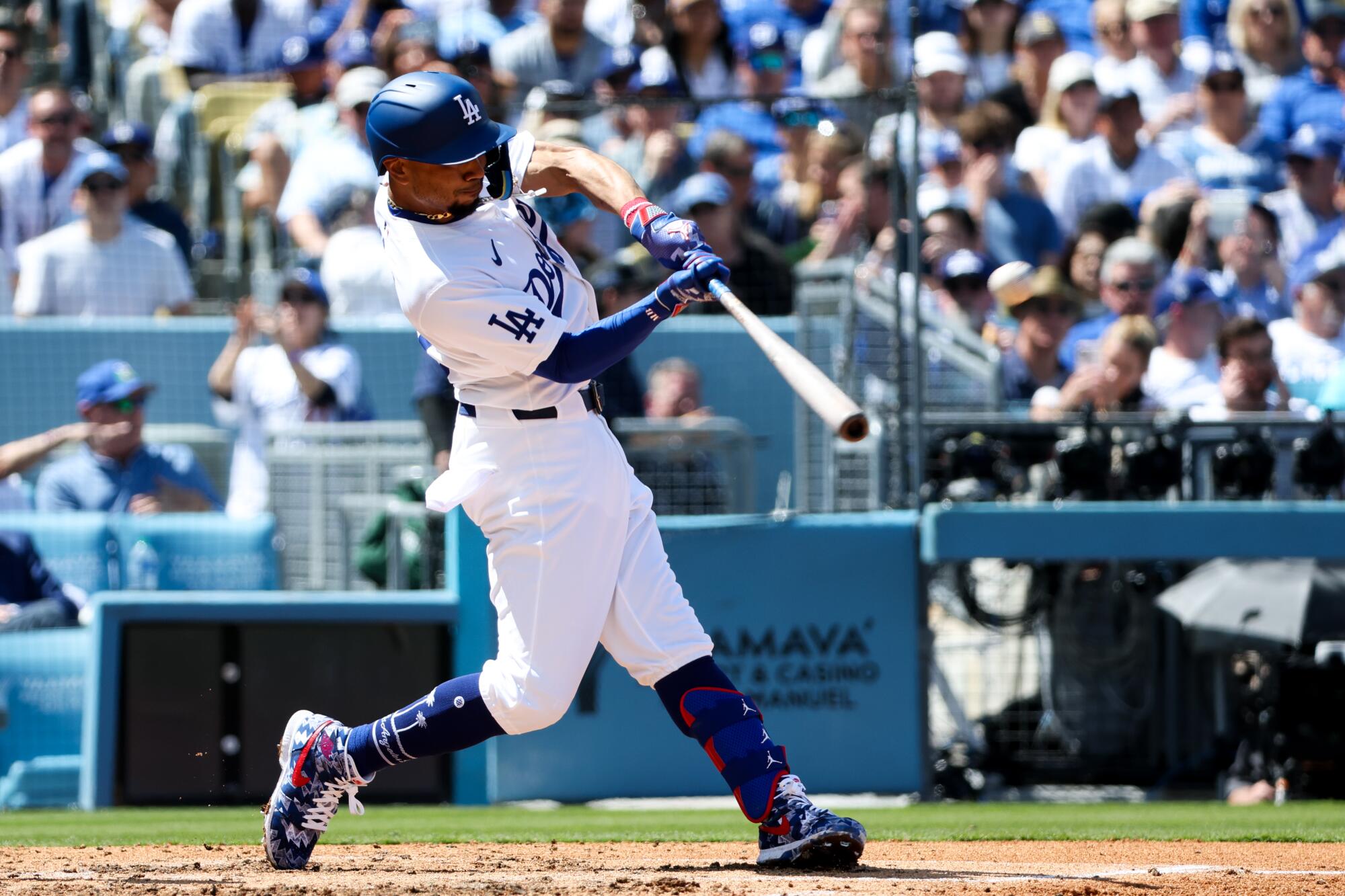 Mookie Betts hits a solo home run during the third inning Thursday against the St. Louis Cardinals at Dodger Stadium.