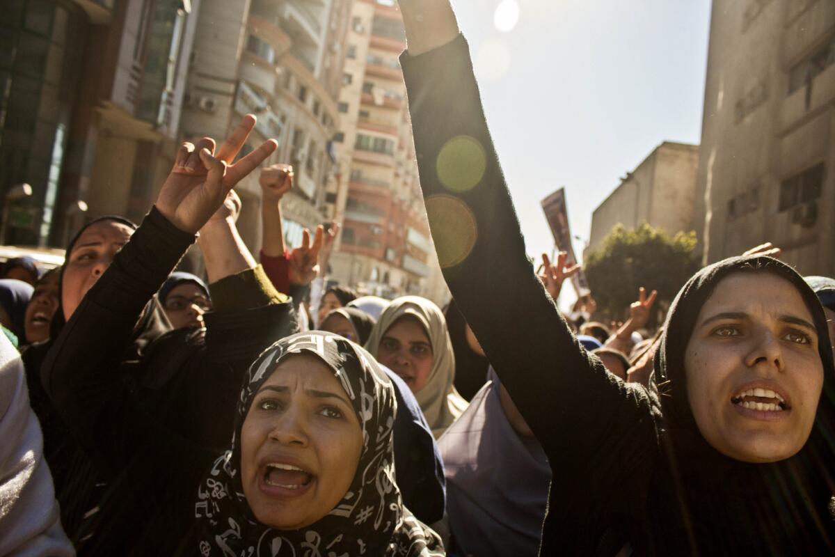 Egyptian women chant slogans during the funeral of victims killed by an explosion at a police headquarters in the city of Mansoura. On Wednesday, Egypt's government declared the Muslim Brotherhood a terrorist organization, although it apparently was not responsible for the Mansoura bombing.