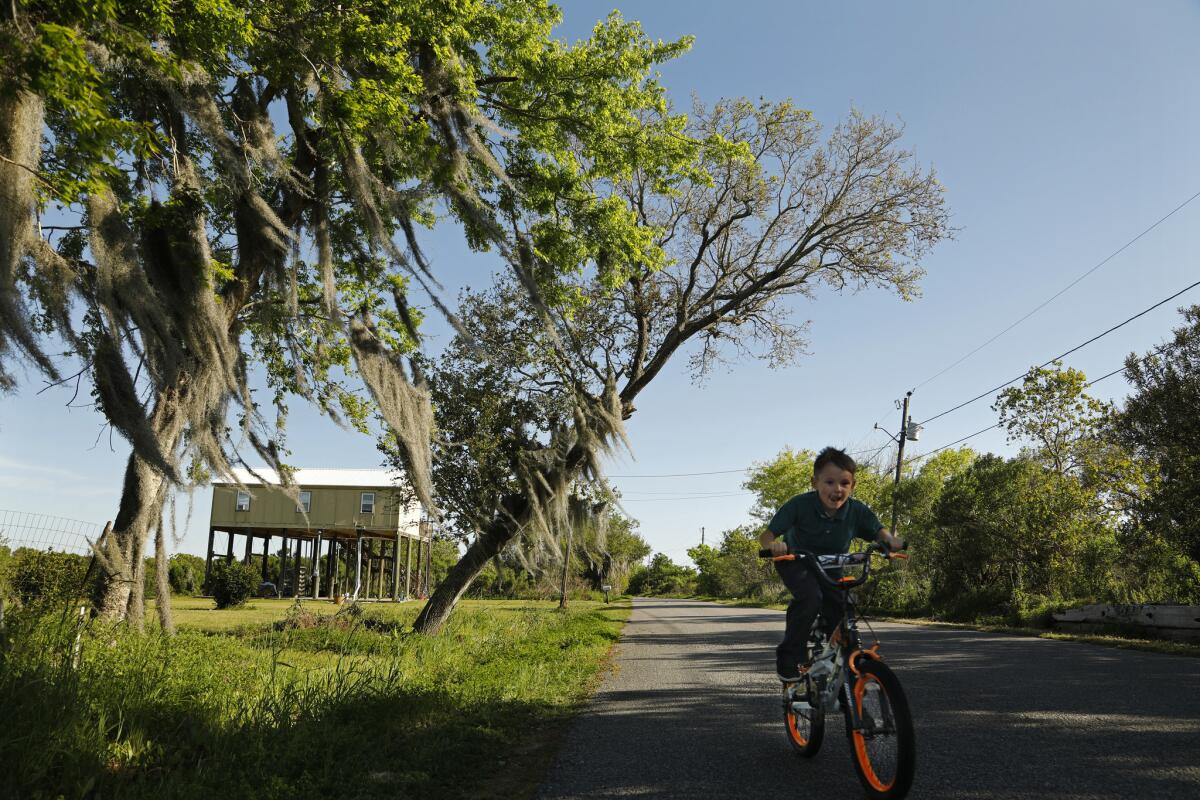 Tristan Billiot is one of the last children remaining on the island, lives with is mothers and grandmother. Many of this friends have moved away. (Carolyn Cole / Los Angeles Times)