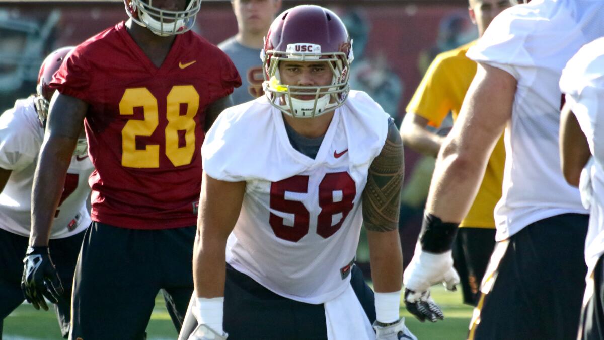 Linebacker Osa Masina awaits his turn in a drill during USC's fall training camp on Aug. 4.