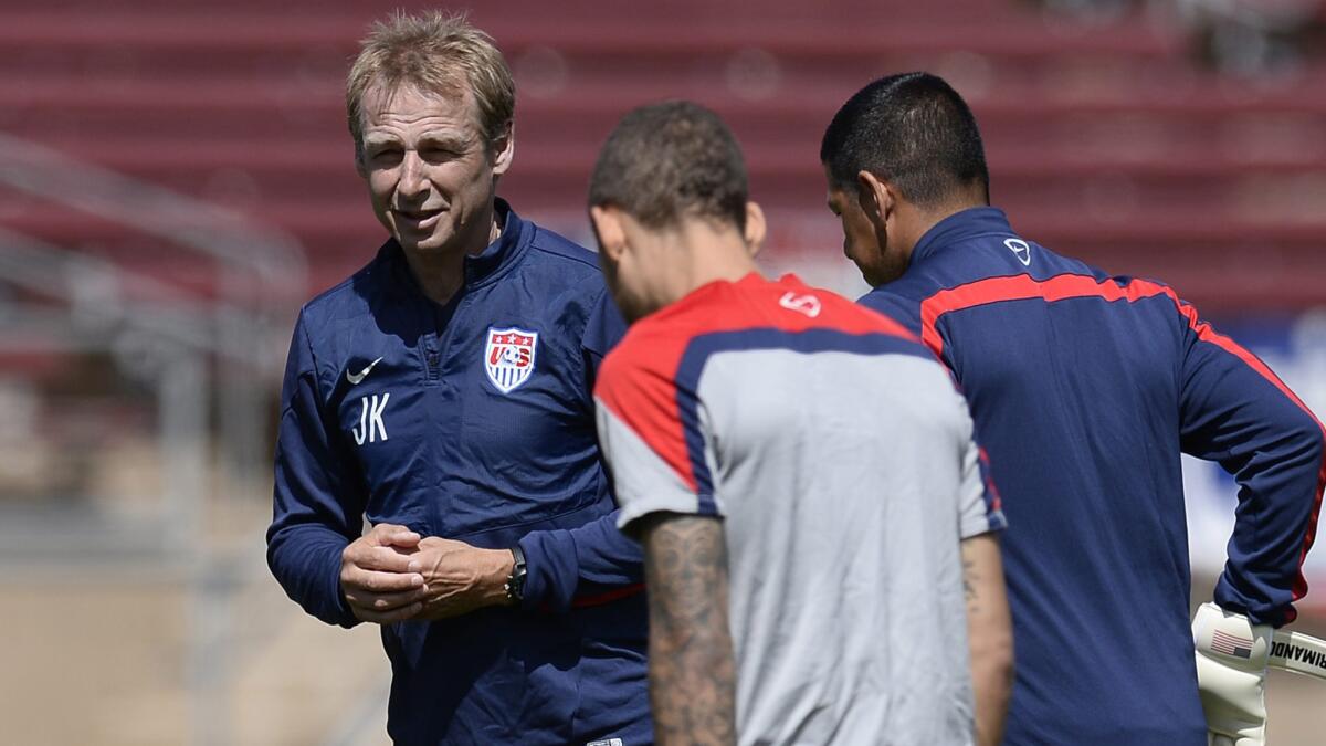 U.S. soccer Coach Juergen Klinsmann works with his players during a training session in Palo Alto on Thursday. It appears Klinsmann is still in the process of fully evaluating some of his players.