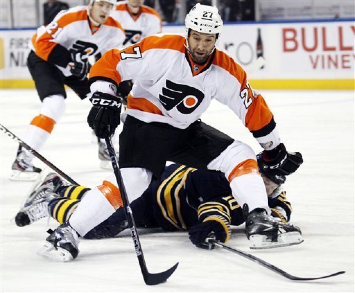Philadelphia Flyers' Maxime Talbot (27) tries to get past Buffalo Sabres' Christian Erhoff (10), of Germany, during the first period of an NHL hockey game in Buffalo, N.Y., Wednesday, Dec. 7, 2011. (AP Photo/Derek Gee)