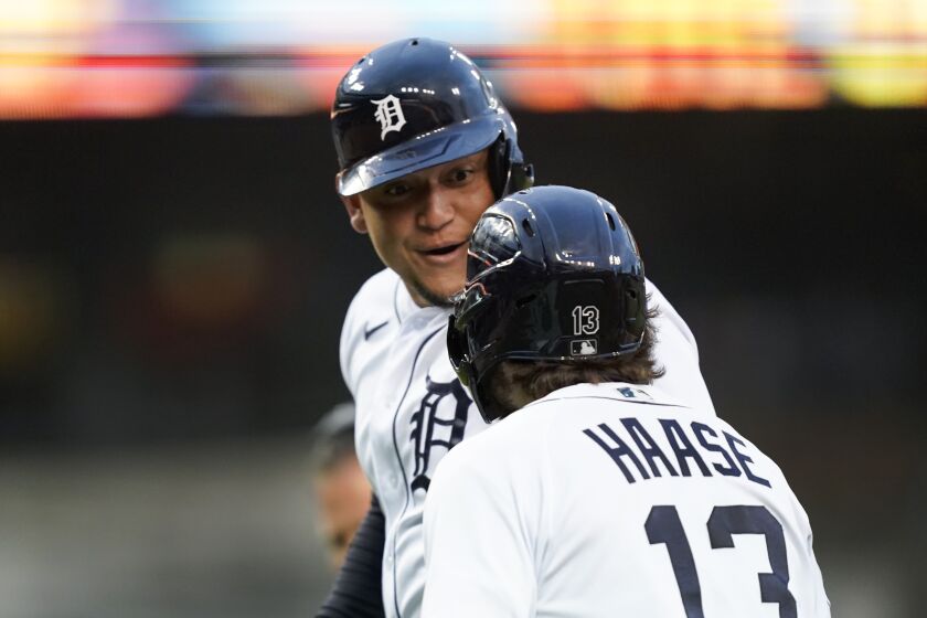 Detroit Tigers' Miguel Cabrera celebrates with Eric Haase (13) after hitting a two-run home run against the Kansas City Royals in the first inning of a baseball game in Detroit, Wednesday, Sept. 28, 2022. (AP Photo/Paul Sancya)