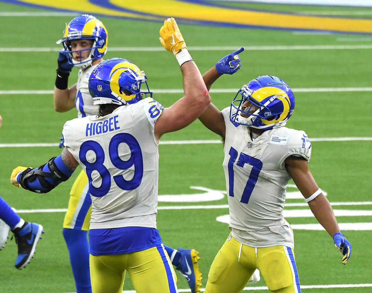 Rams receiver Robert Woods (17) and tight end Tyler Higbee celebrate.