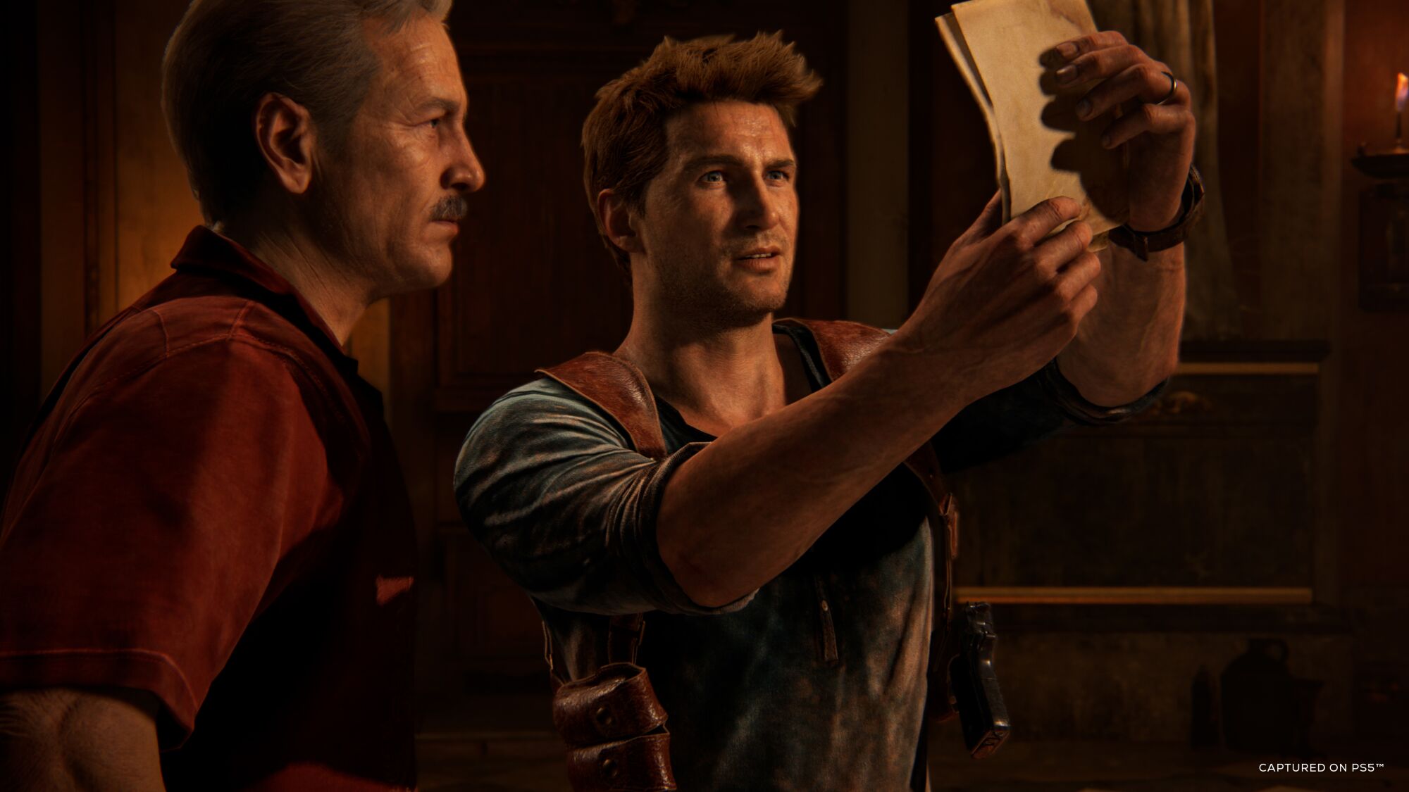 In a video game, two men study a piece of paper.