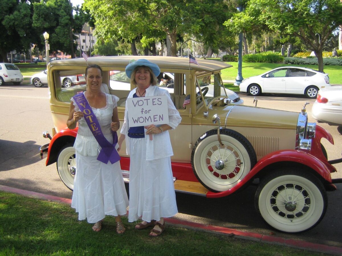 Donna Lilly and Linda Quinby, past presidents of the Del Mar-Leucadia Branch of AAUW, are dressed to celebrate Women’s History Month and honor the suffragettes.