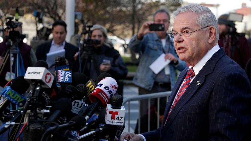 Sen. Robert Menendez (D-N.J.) speaks to reporters outside the courthouse after a a mistrial was declared in his trial on corruption charges in Newark, N.J., on Nov. 16, 2017.